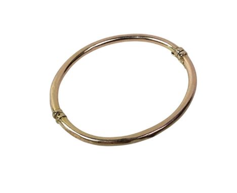 GOLD BANGLE, NINE CARAT GOLD of oval form, marked 375 for nine carat gold, boxed7cm wideQty: 4.63g
