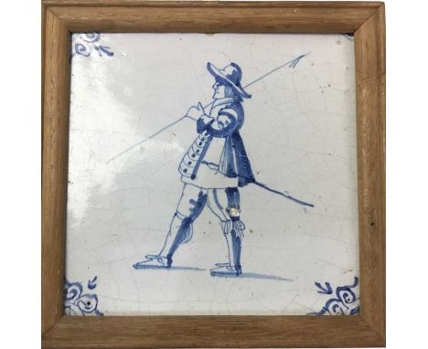 DUTCH DELFT TILE, 18TH CENTURY  decorated with a military pike man in a modern wooden frame, along with a 19th Century contin