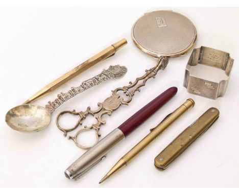 Silver napkin ring, powder compact, sugar nips and various pens We cannot do condition reports for this sale.