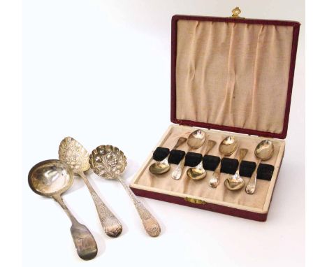 A boxed set of six silver teaspoons, a Georgian embossed silver tablespoon and an embossed silver ladle and another plain sil