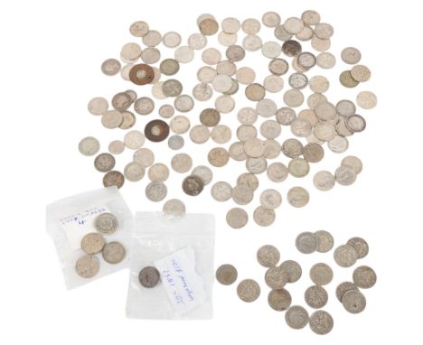 A collection of British silver Threepence coins 19th and 20th Century, also includes model Halfpennies and 1 1/2 Pence coins