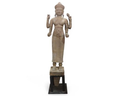 A large scale South East Asian Kumar style sandstone statue, in the form of a female deity with 4 arms, Grand Tour Period or 