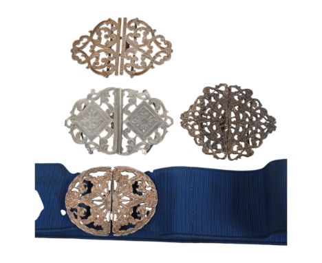 4 1950/60s' silver nurses buckles, two with hallmarks, total 104.9gAll have bent belt loops, otherwise good condition with we