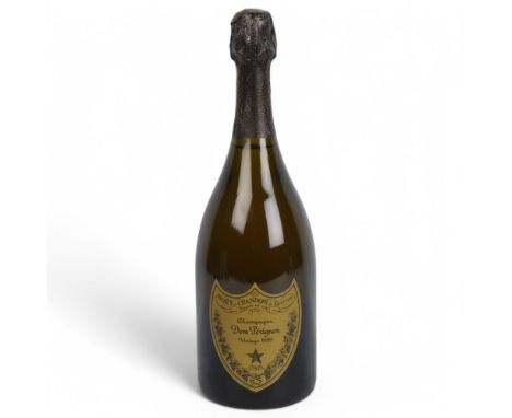 A bottle of Dom Perignon Vintage 1999 Champagne, 750mlGood condition, capsule intact, level to bottom of foil
