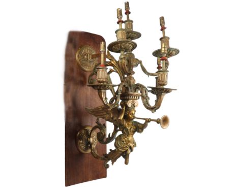 A large and impressive Victorian gilt-brass 6-branch wall-mounted candelabra, supported by a winged angel, converted to elect