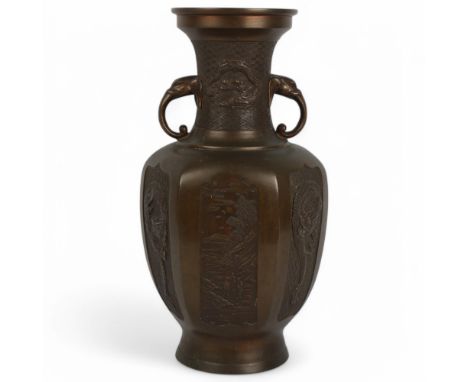 A Chinese patinated bronze 5-sided vase, with elephant handles and dragon panels, height 40cm