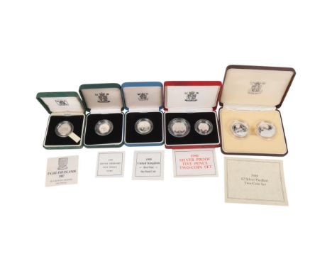 A collection of Queen Elizabeth II silver proof coins, all boxed with certificates
