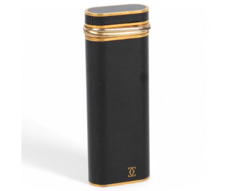 CARTIER - a gold plate and black lacquer pocket lighter, height 7cm