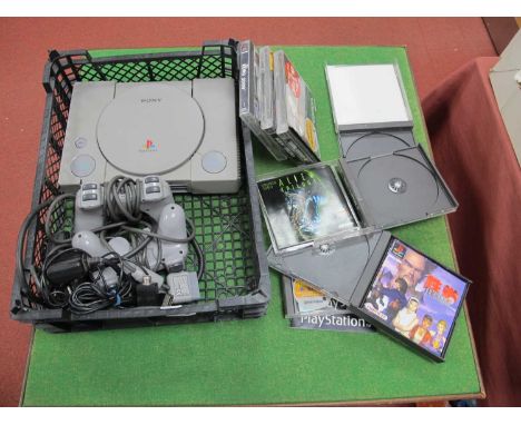 A Sony PlayStation (PS1) Games Console (untested for working order spares/repair), Two Hand Controllers, Together with a quan