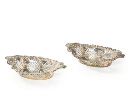 A pair of late Victorian silver sweetmeat baskets. William Hutton & Sons, Birmingham,1899.The navette-shaped baskets designed