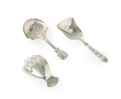 Three 19th century silver caddy spoons.Various dates and makers. The group comprising: a George III silver right hand caddy s