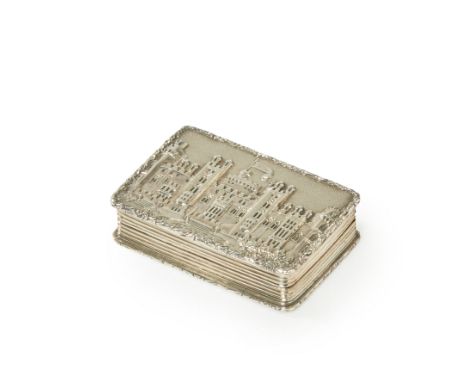 A silver 'castle top' vinaigrette. Nathaniel Mills, Birmingham, 1837. Of rectangular form, the hinged cover decorated with a 