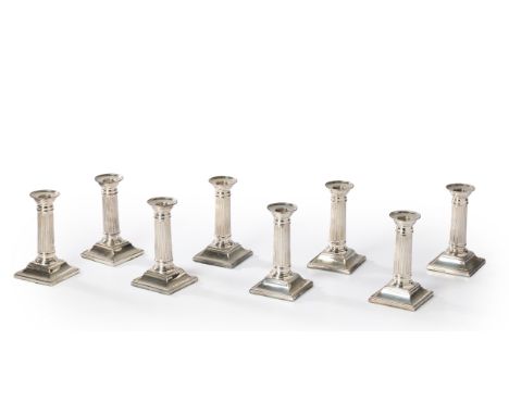 A set of eight columnar silver candlesticks.C.J. Vander, London, 2001. The short candlesticks designed as reeded columns rais