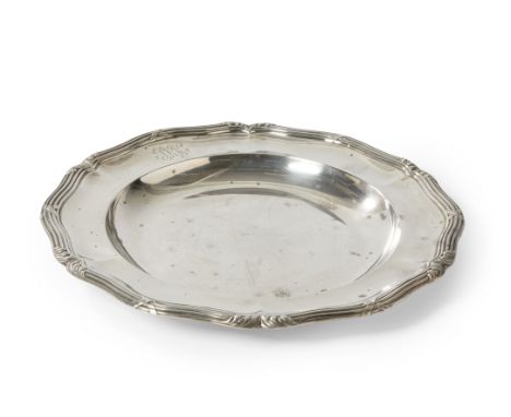 A French silver serving plate. Odiot, 20th century. Of shaped, circular form with reed and ribbon border decorated with folia