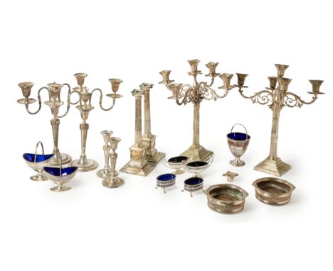 A group of silver plated items. The group including: two pairs of candelabra with detachable arms, one pair designed with col