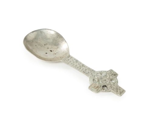 A silver caddy spoon with Celtic cross terminal. Shipton & Co.,Chester, 1958. The hammered bowl to handle designed as St John