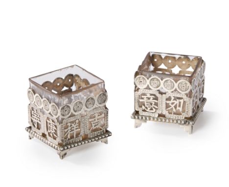 A pair of Chinese export silver salt cellars. Wing Fat, Canton & Hong Kong, c.1900. The square silver mounts pierced with Chi