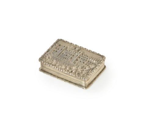 A silver 'castle top' vinaigrette. Nathaniel Mills, Birmingham, 1837. Of rectangular form, the hinged cover decorated with a 