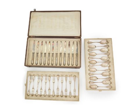 A set of French silver dessert cutlery.Ernest Combeau,Paris, c.1920. The set comprising: 12 teaspoons, 12 dessert forks and 1