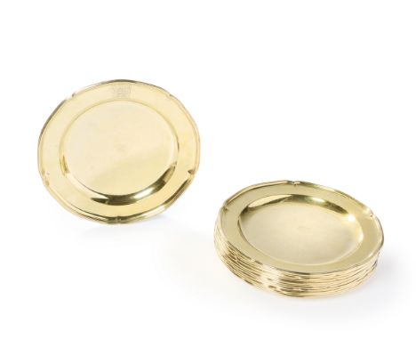 A set of twelve George III silver gilt plates. John Wakelin & William Taylor, London, 1787. Of shaped, circular form, the pla