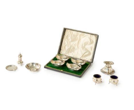 A boxed set of novelty silver salt cellars.Gorham Manufacturing Co.,Birmingham, 1911. The four salt cellars designed as swing