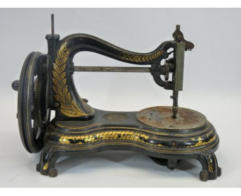 JONES HAND CRANK SEWING MACHINE in a vintage wooden box