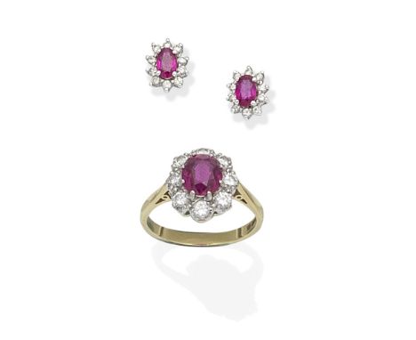 RUBY AND DIAMOND CLUSTER RING AND EARRING SUITEThe oval-cut ruby within a surround of brilliant-cut diamonds, mounted in 18 c