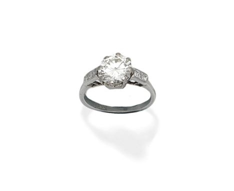 DIAMOND SINGLE-STONE RINGThe central brilliant-cut diamond set between step-cut diamond set shoulders, principal diamond appr