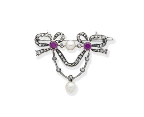 DIAMOND, PEARL AND RUBY BROOCH, CIRCA 1900The two bows set with old brilliant-cut diamonds, suspending two similarly-cut diam