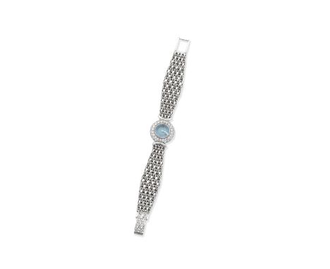 AUDEMARS PIGUET: DIAMOND AND TOPAZ DRESS WATCHThe blue topaz set atop a round, guilloché enamel dial, to a brilliant-cut diam