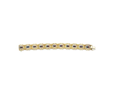 ENAMEL BRACELETOf open, scrolling design, each link decorated with an enamelled floral motif, length 19.1cmFor further inform