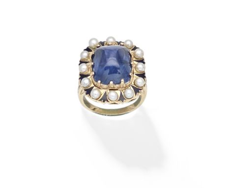 SAPPHIRE, SEED PEARL AND ENAMEL RINGThe central sugarloaf sapphire within a seed pearl and blue enamel surround, the shoulder