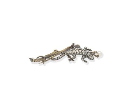 DIAMOND AND PEARL-SET LIZARD BROOCH, CIRCA 1900The lizard set throughout with rose-cut diamonds on a textured branch with a p