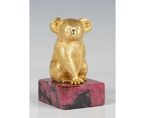 A mid-20th century Australian gold model of a koala bear by S.A. Schagen, detailed 'S.A. Schagen 18ct' to rear, mounted on a 