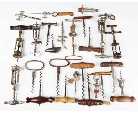 A collection of mainly late 19th and early 20th century corkscrews and champagne taps, including 'The King Patent 6064' open 