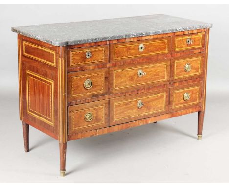 A late 18th century French mahogany and walnut marble-topped commode, the five drawers and sides with chequer inlaid borders,