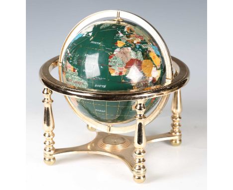 A modern gilt metal framed table globe, the surface of the globe veneered in hardstone, width 31cm.