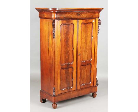 A late 19th century French mahogany side cabinet, fitted with a cushion frieze drawer above a pair of panelled doors, height 