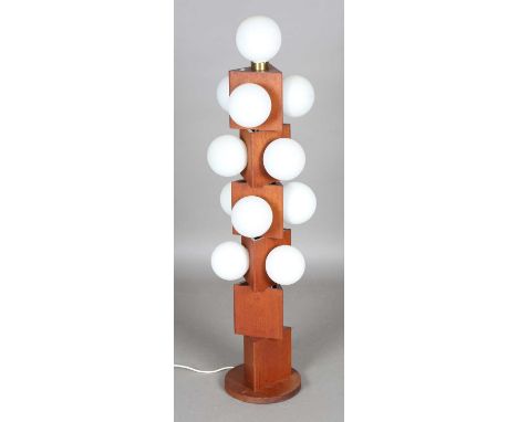 A mid-20th century teak and opaline glass multiple light floor lamp, in the manner of Jette Hellerøe, the triangular section 