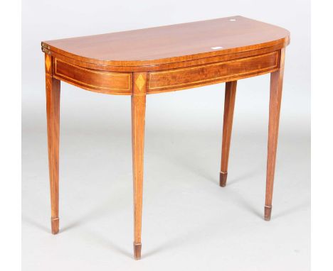 A George III mahogany fold-over card table with boxwood stringing and tulipwood crossbanding, height 72cm, width 91cm, depth 