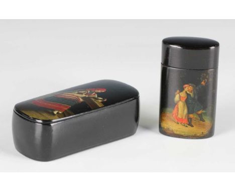 An early 20th century Russian papier-mâché snuff box, the hinged lid painted with a seated lady, the interior with gilt eagle