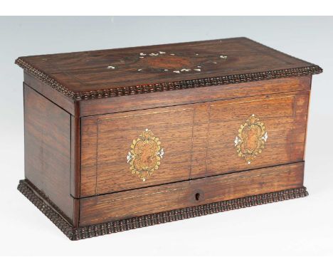 A mid-Victorian rosewood and brass inlaid tea caddy, the hinged lid and front inlaid in pollard oak, brass and ivory with fol