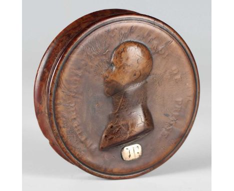 An early 19th century pressed maple circular snuff box, the lid decorated in relief with a profile portrait of 'Frederic Guil