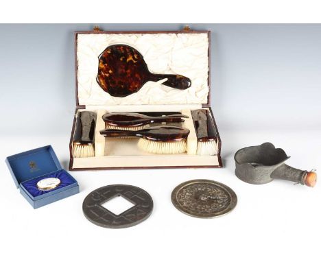 A mid-20th century tortoiseshell dressing table set, cased, a Halcyon Days enamel box, cased, a Chinese bronze mirror and two