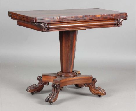 An early Victorian rosewood fold-over card table, raised on claw feet, height 73cm, width 92cm, depth 45cm.