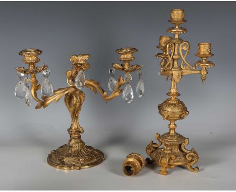 A 19th century Rococo Revival ormolu twin-branch candelabrum, hung with glass drops, height 27cm, together with a late 19th c