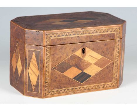 A good George III specimen inlaid tea caddy, the hinged lid and sides veneered in lozenge reserves of various woods on a burr