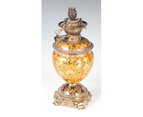 A late Victorian gilt brass and pottery table oil lamp, the wick winders detailed 'Messengers No. 2', height to burner 34cm (