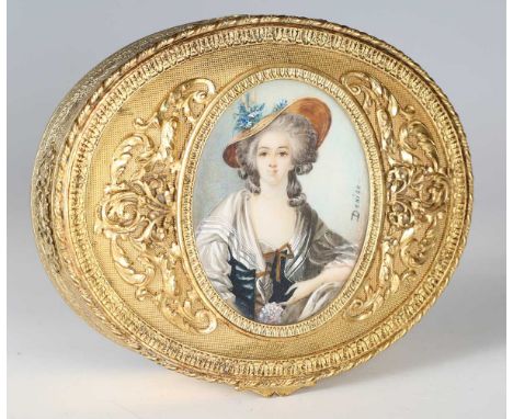 An early 20th century French ormolu oval dressing table box, the hinged lid inset with a half-length portrait miniature of a 