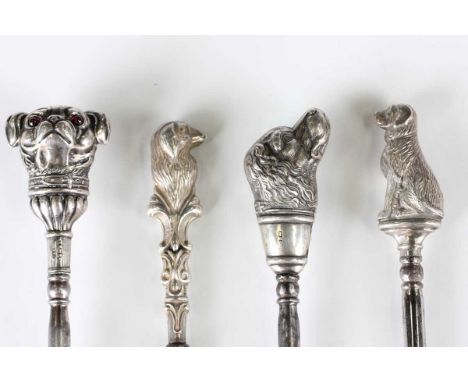An Edwardian silver handled novelty button hook, the handle in the form of a dog's head with inset pink glass eyes, Birmingha